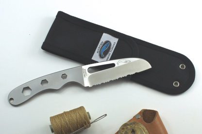 A knife and some string on top of a table.