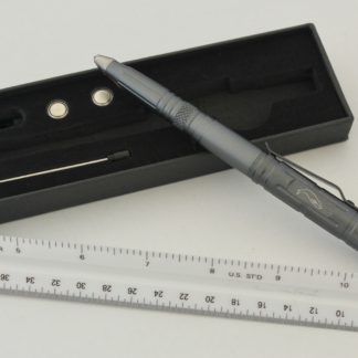 A pen and ruler are next to each other.