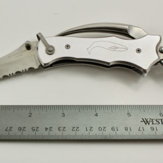 silver pocketknife with whale emblem