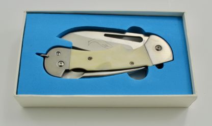 cropped knife with bone handle folded in blue box