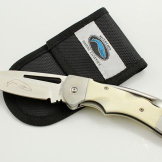 A knife that is laying on top of a wallet.