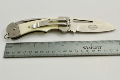 cropped knife with bone handle and ruler