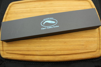 maroon knife box on wooden plate