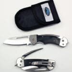 Folding knife with protective sheath and unique design.