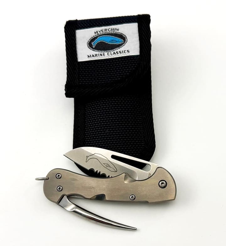 Folding knife with sheath and marine logo.