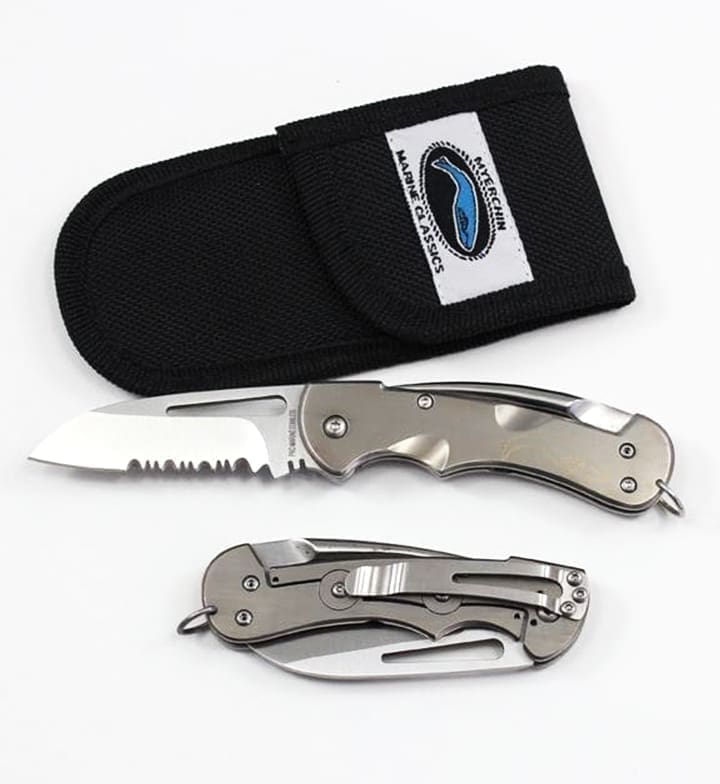Folding knife with sheath and serrated edge.
