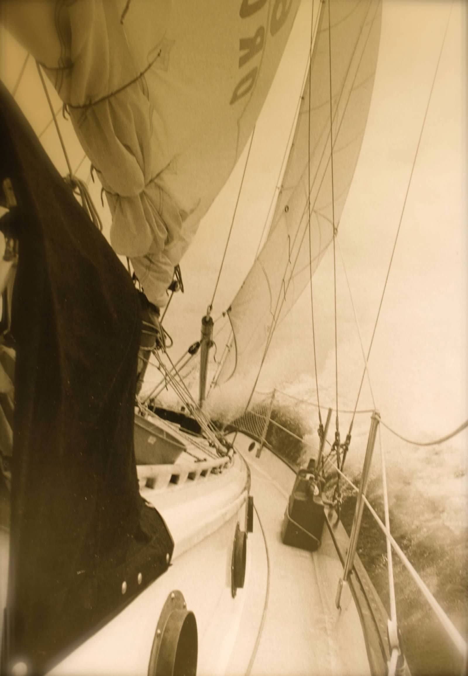 Sailing vessel navigating through choppy waters.