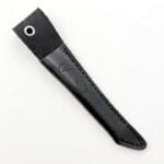 Black leather knife sheath with embossed design.